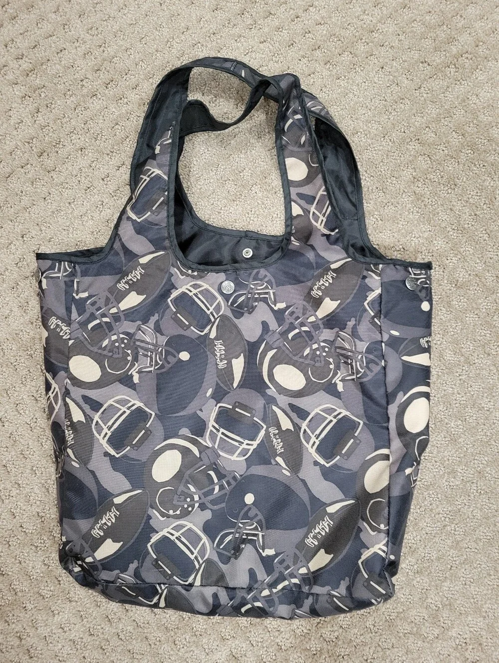 Double handle bag, snap closure, flat bottom, football pattern, like new